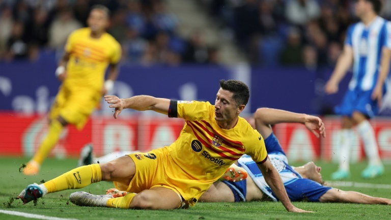 Barca win La Liga title with Espanyol rout