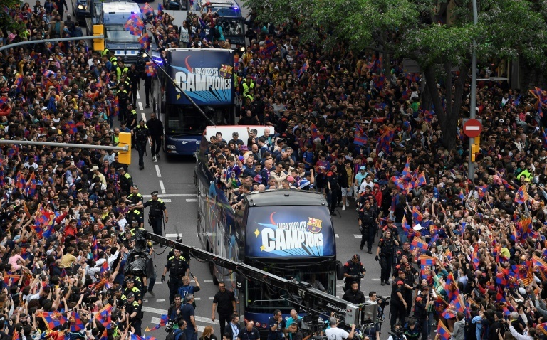 Barca fans celebrate La Liga title with players in parade