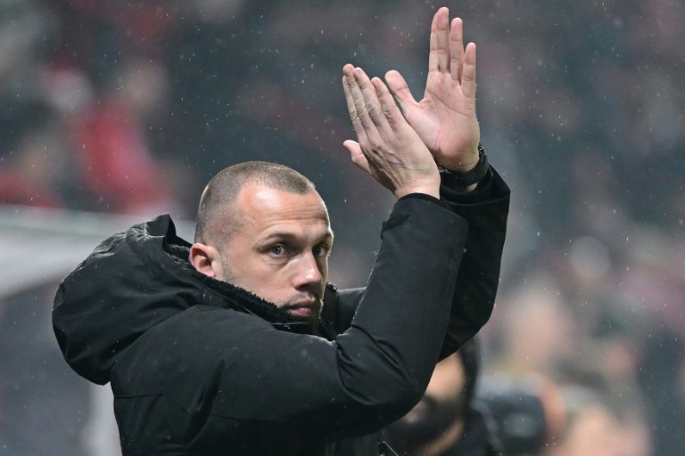 Ajax seek new coach after axing Heitinga