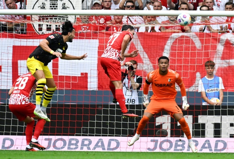 Hummels brace inspires Dortmund to comeback win over 10-man Freiburg