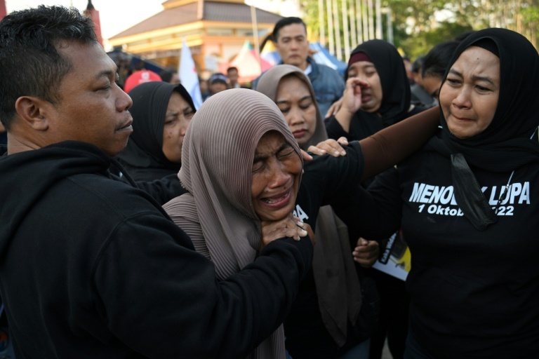 Indonesians pay tribute to victims of stadium disaster one year on