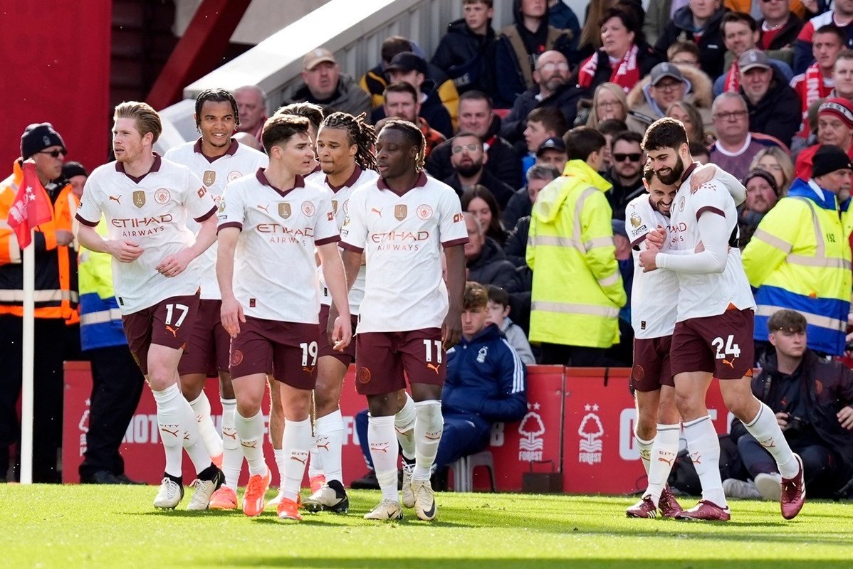 Man City threaten Arsenal for top spot after beating Forest