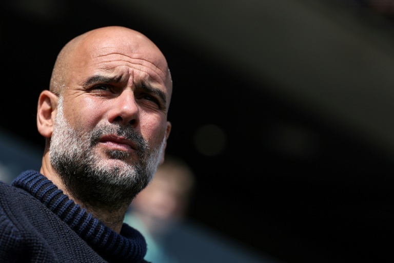 Guardiola urges Man City to seize chance to make Premier League history