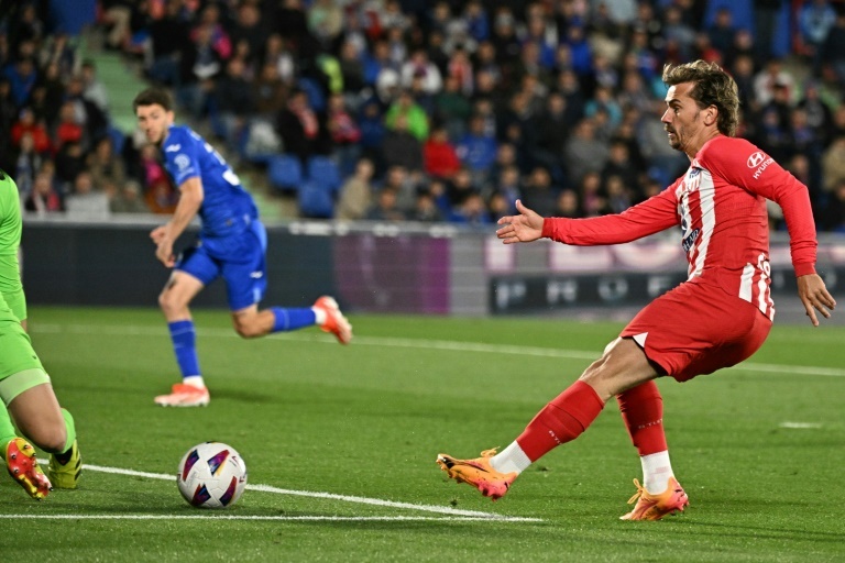 Griezmann hat-trick fires Atletico Madrid into Champions League