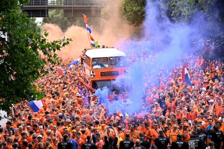 Orange bus leads Dutch fan parade at Euros