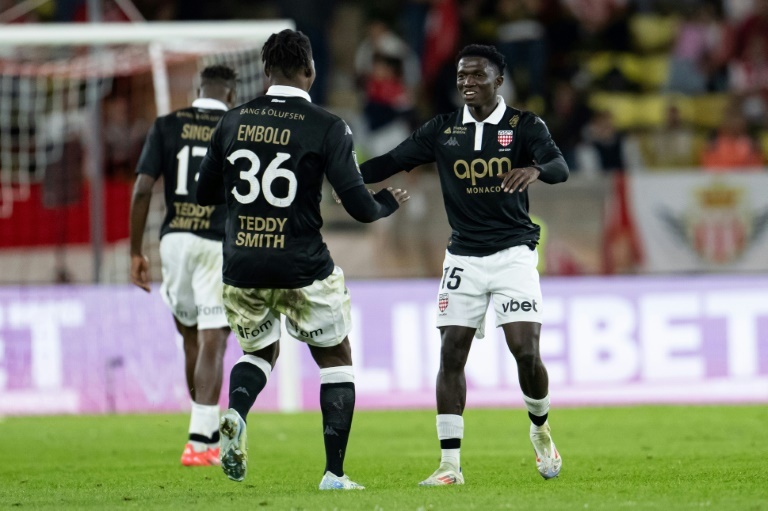 Monaco celebrate centenary with late win to join PSG at the top