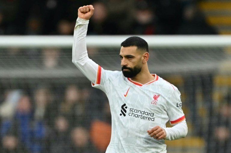 Salah brace fires Liverpool nine points clear