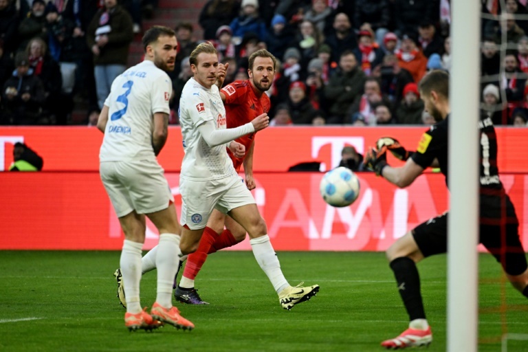 Leaders Bayern survive late Kiel fightback to go nine points clear