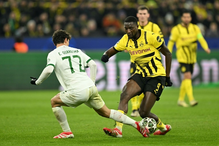 Dortmund ease into Champions League last 16 after Sporting stalemate